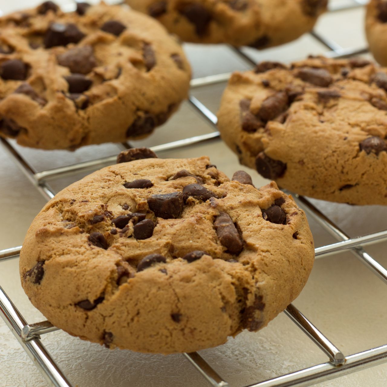 Homemade chocolate-chip cookies on a cooling rack