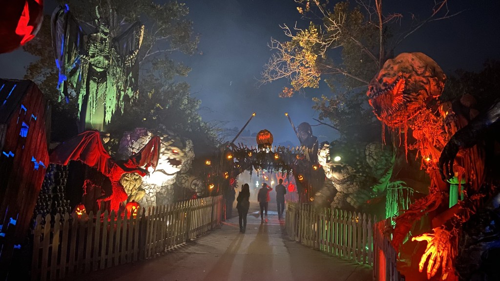 A spooky Halloween trail entrance decorated with lights (illustrative photo)